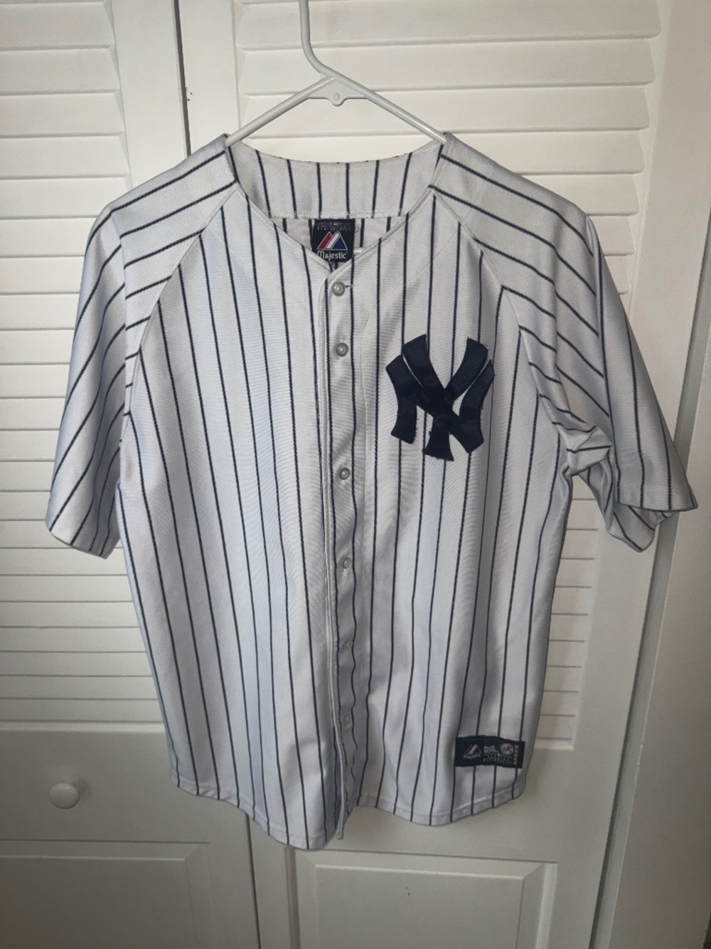 Majestic New York Yankees baseball jersey featuring classic navy pinstripes